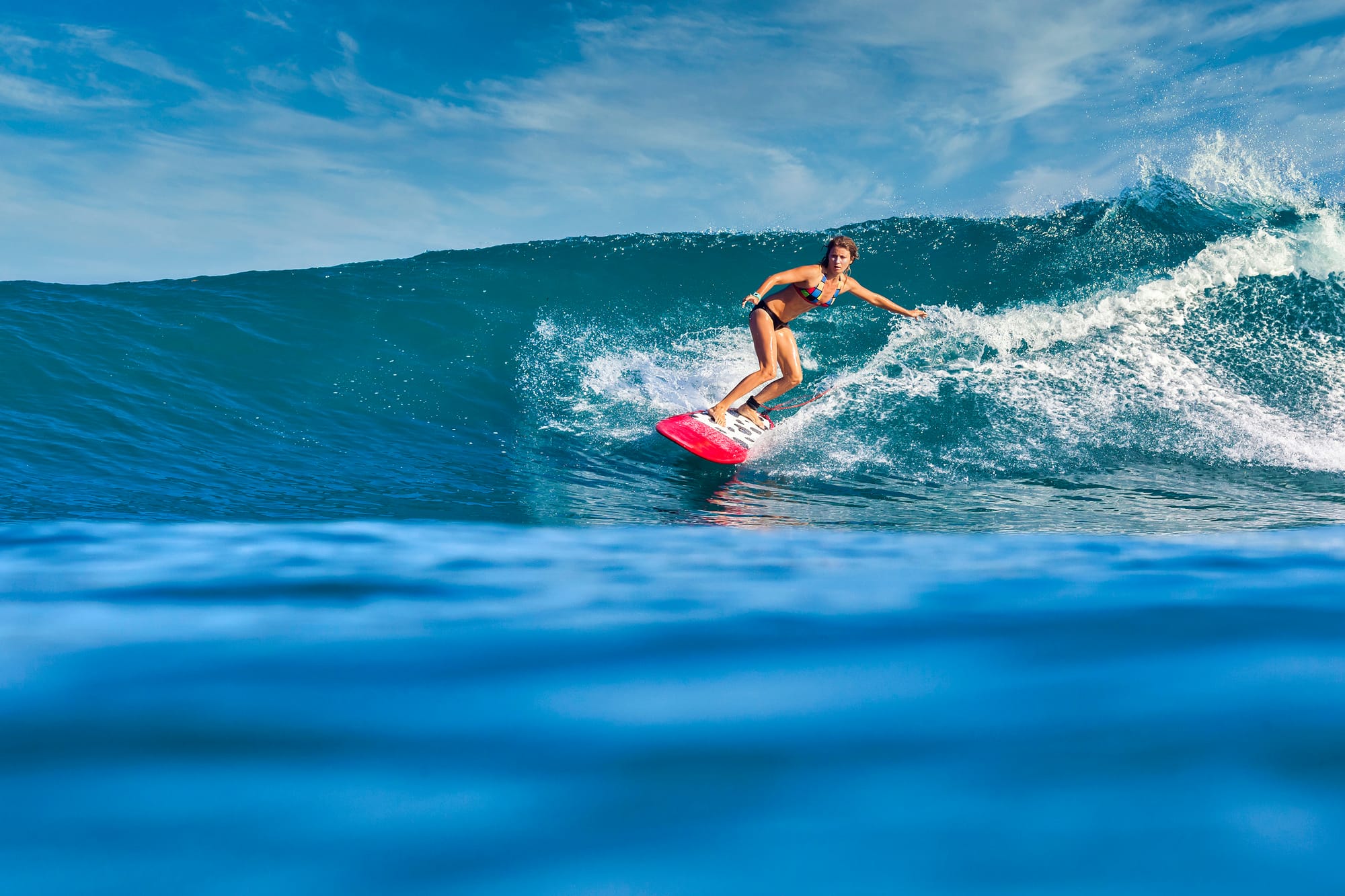 female-surfer-on-a-blue-wave-2025-01-07-23-18-47-utc.jpeg