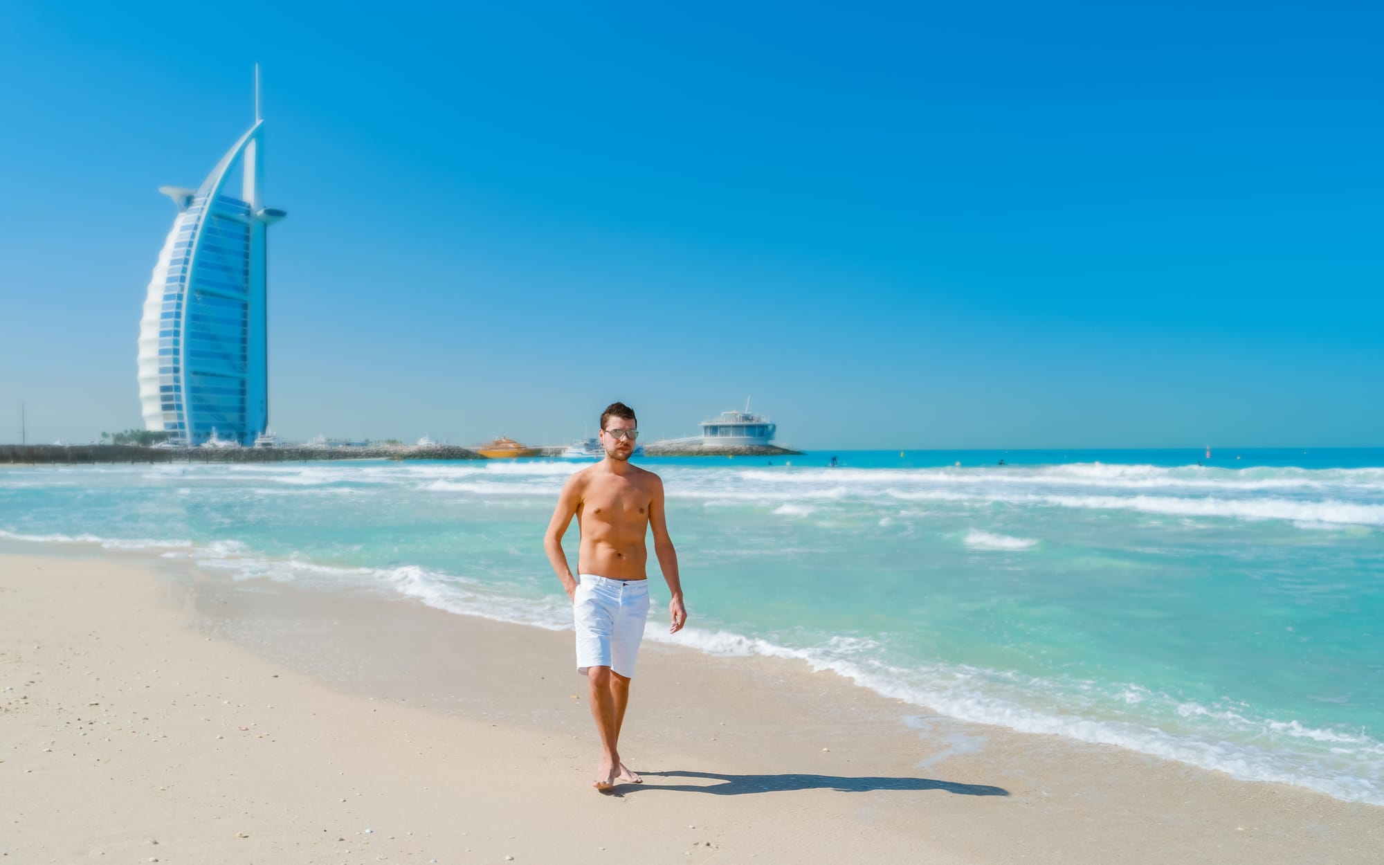 young-man-in-a-swim-short-on-the-beach-in-dubai-j-2025-01-09-12-09-35-utc.jpg